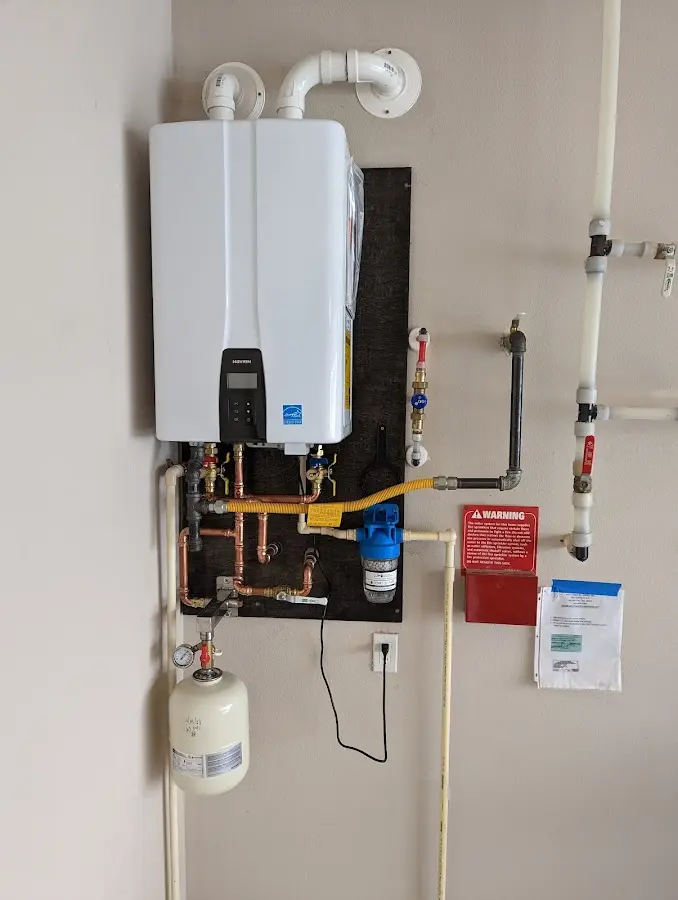 Professional plumber installing copper piping in a El Dorado home